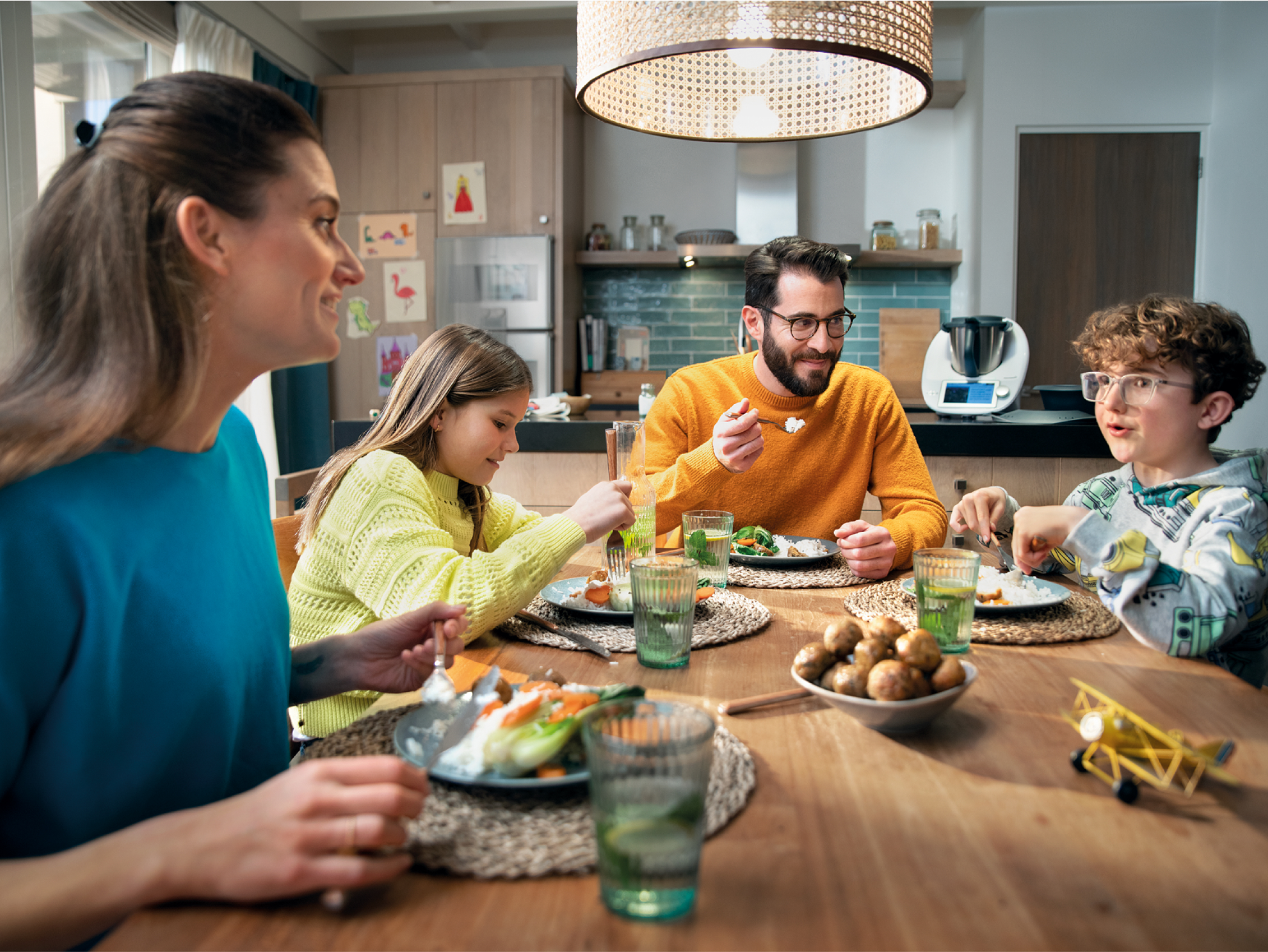 Family gathered for dinner; people sitting at the table